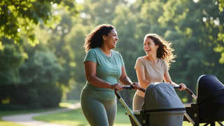 Two women pushing a stroller together in a park